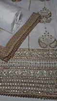 Load and play video in Gallery viewer, Unstitched Georgette Embroidered Suit
